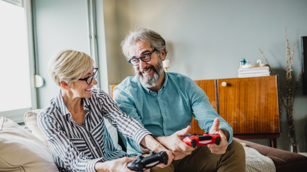 An older couple playing video games, in reference to them wondering whether they are too old to remortgage