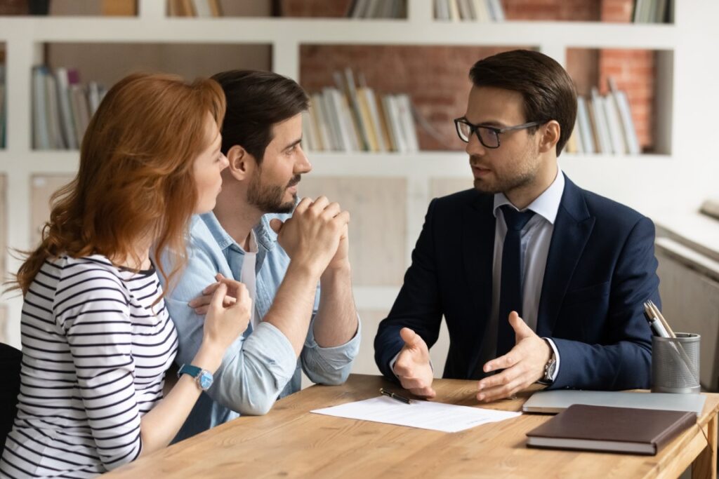 Couple talking to mortgage broker about whether to get 2-year, 5-year, or 10-year fixed-rate mortgage