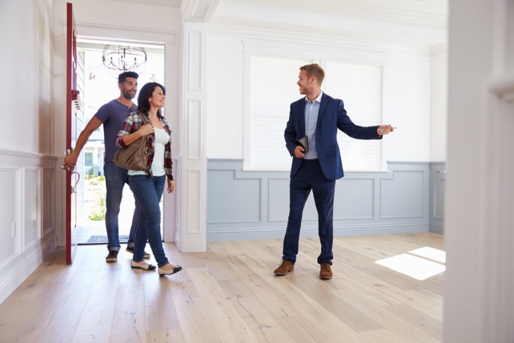 Couple viewing a house after getting a mortgage in principle