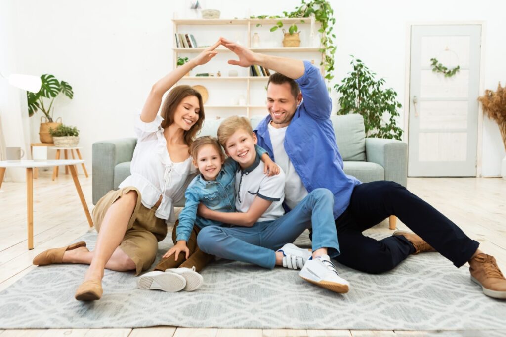 Parents protecting their children symbolically representing life insurance and critical illness cover