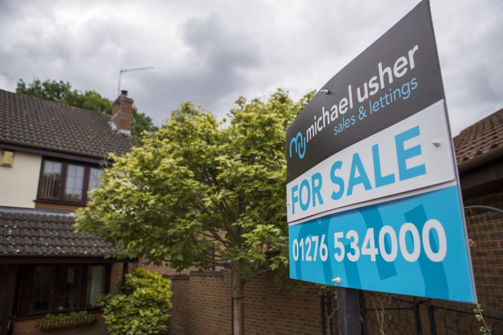 Michael Usher for sale sign outside of house