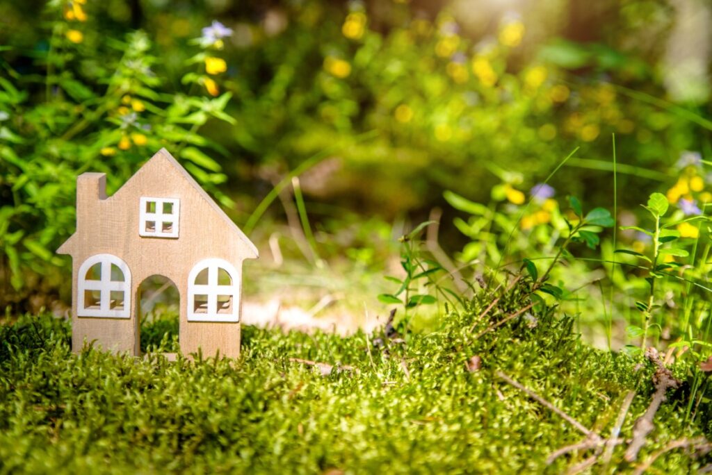 A modal house in a garden, symbolising a green mortgage