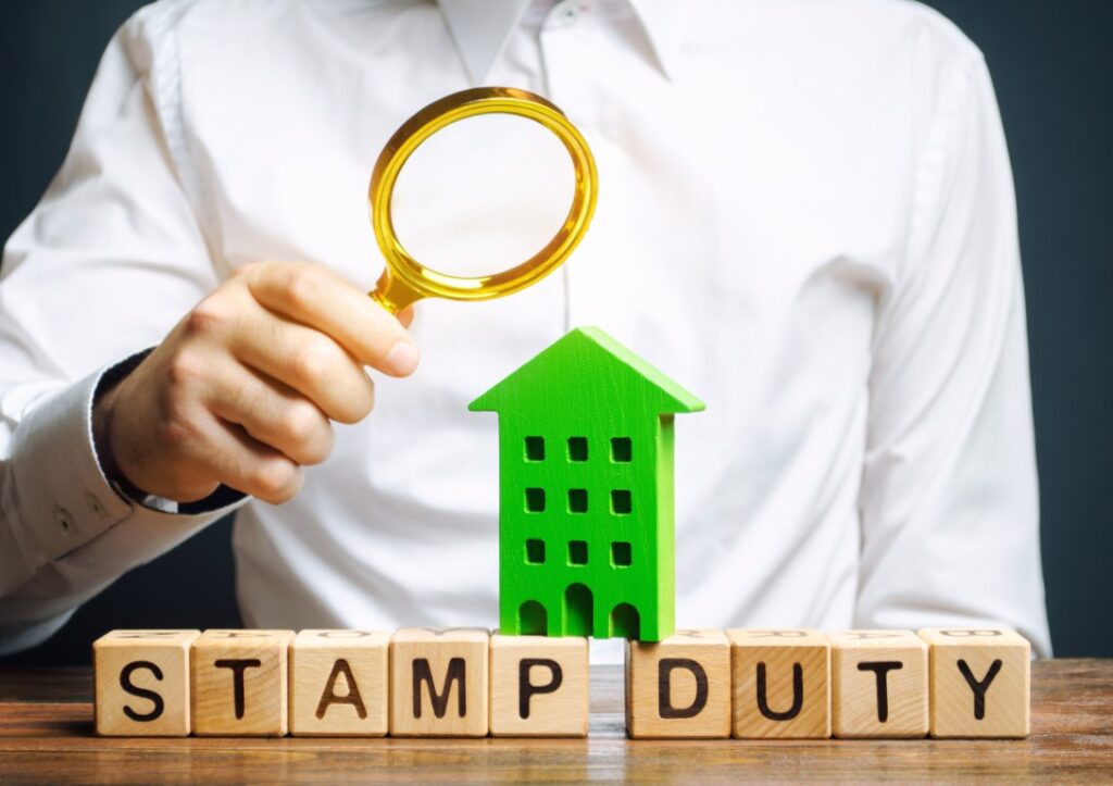 A man having a closer look at Stamp Duty rates